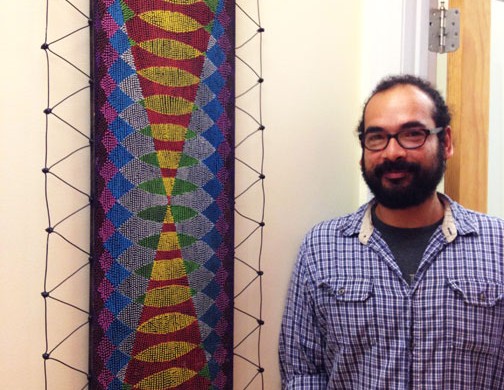 Victor Palomino with his artwork